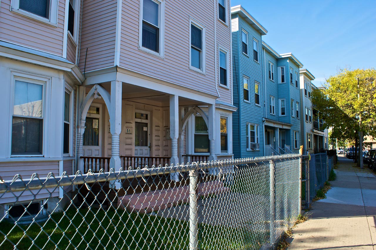 Chain link fence in front of houses