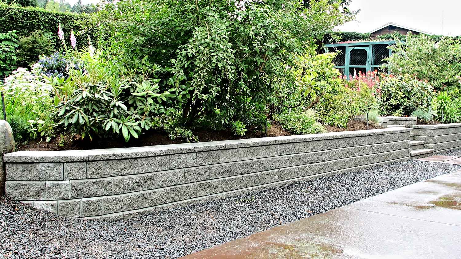 A view of a concrete block retaining wall