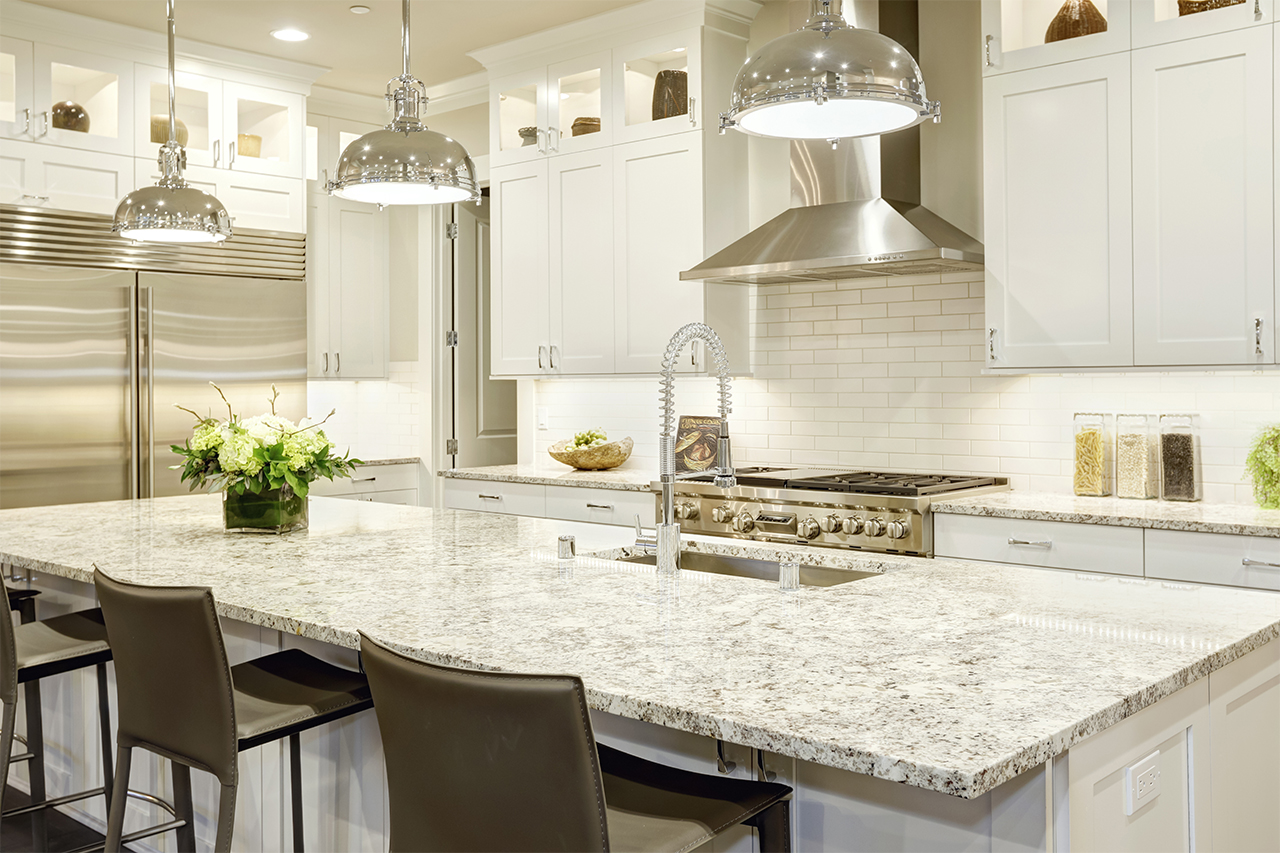 clean white kitchen with granite countertop