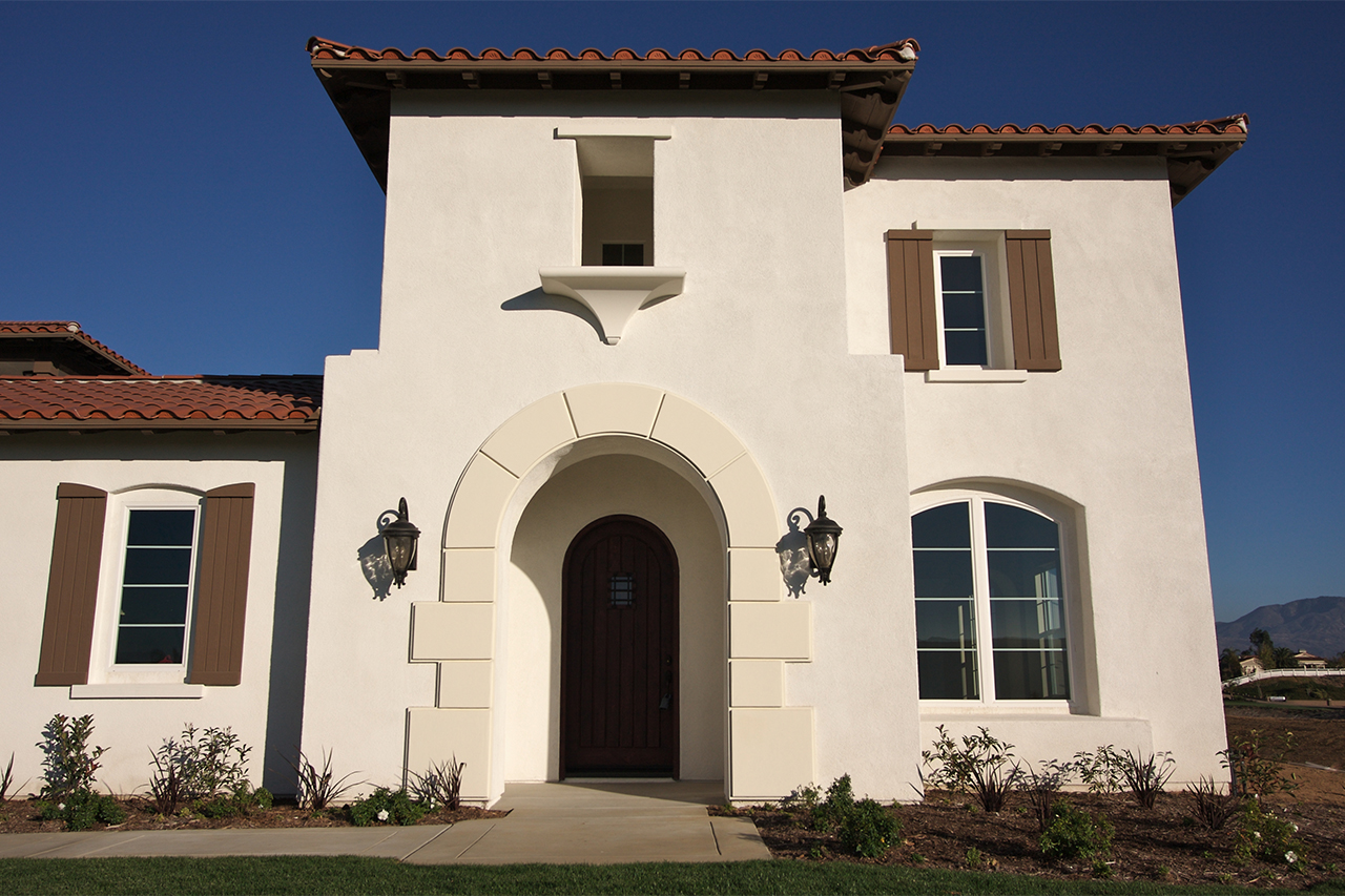 modern home with stucco siding façade