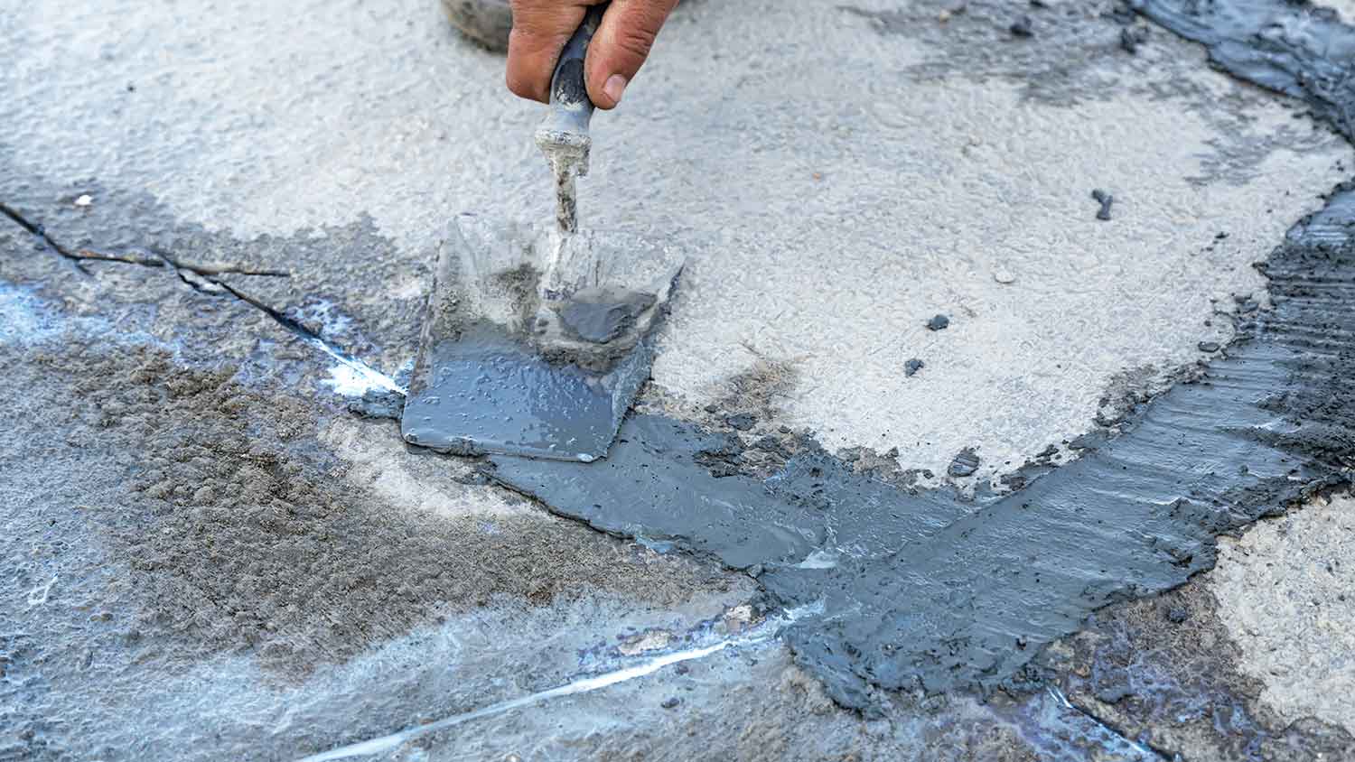 Repairing concrete cracks on a driveway