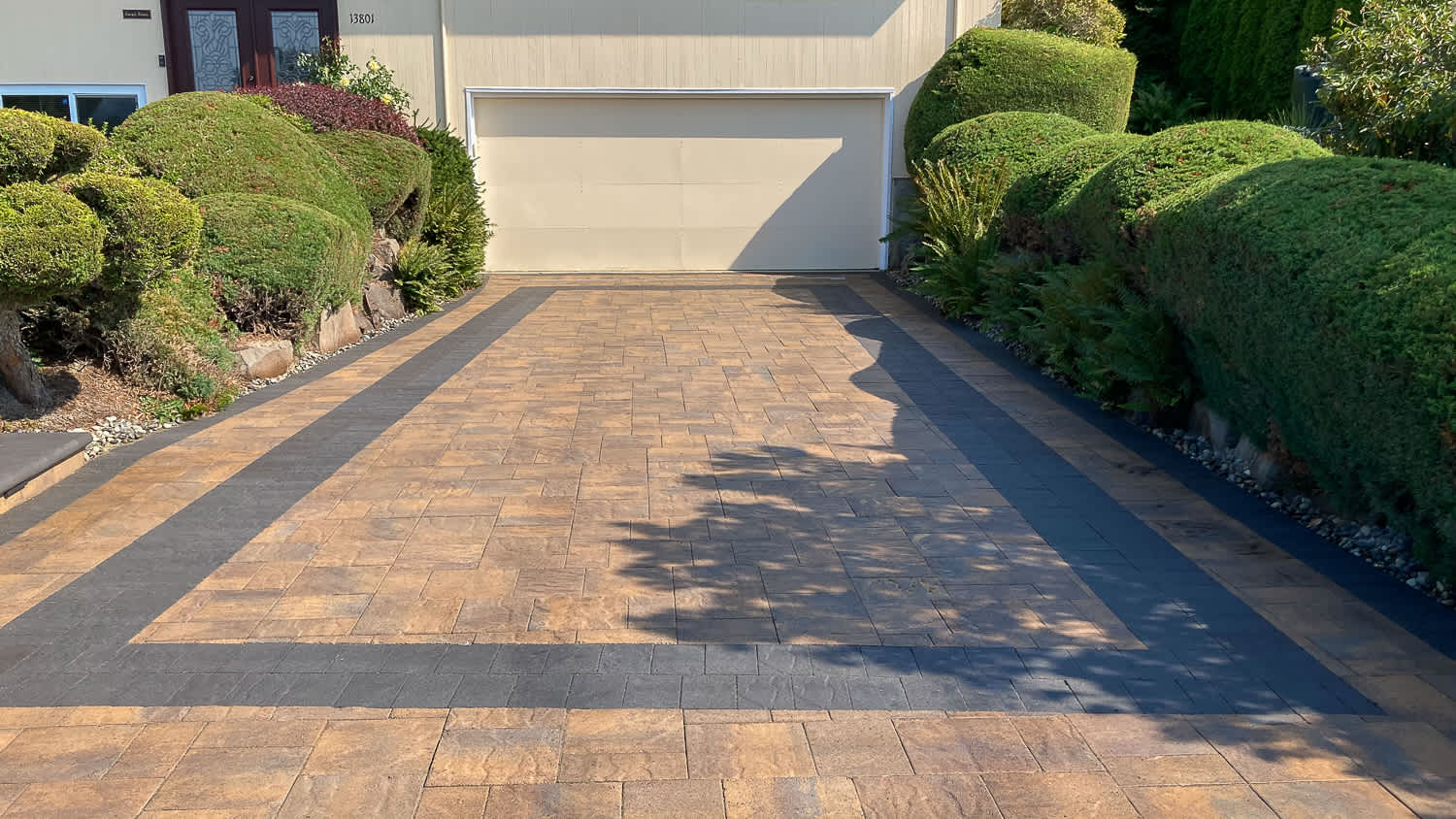 White house with paver driveway